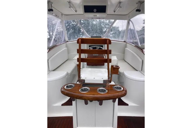 Slide: The Image of Interior of 2006 Calyber 29 Express boat with steering wheel and navigation equipment. - 12