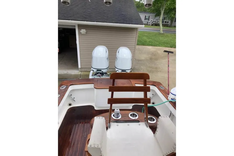 Slide: The Image of Control panel of a 2006 Calyber 29 Express boat, featuring various switches and gauges. - 14