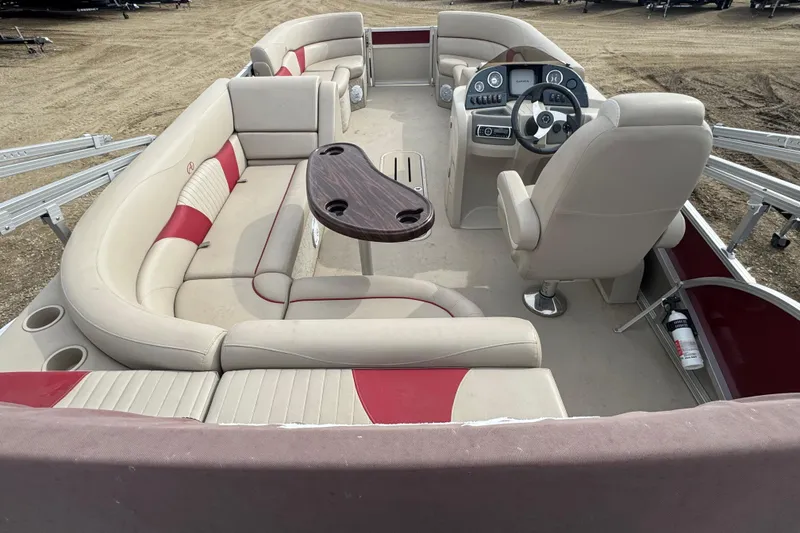 Slide: The Image of 2014 Avalon Windjammer Fish 24' pontoon boat with beige and red seating, steering console. - 14