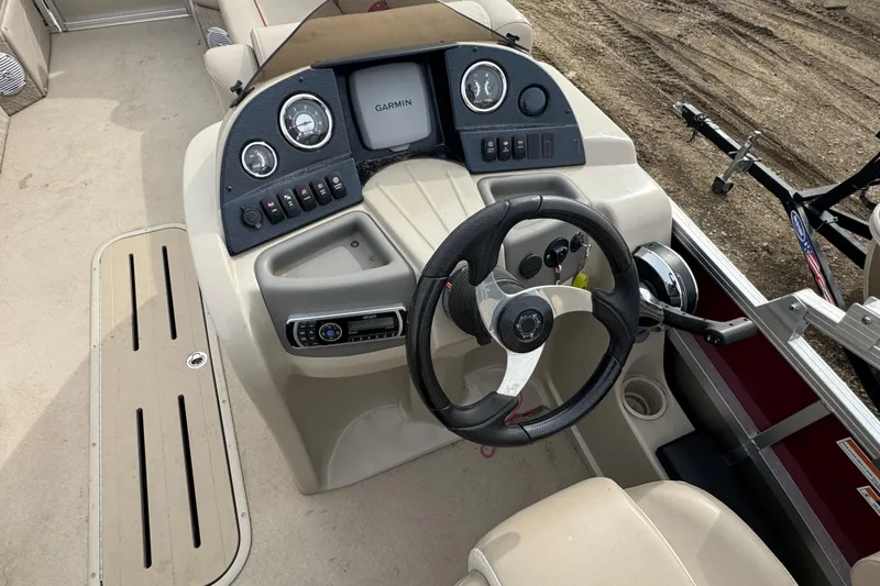 Slide: The Image of Steering console of 2014 Avalon Windjammer Fish 24' boat with Garmin system. - 8