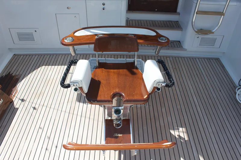 Slide: The Image of 2004 Hudson Custom Carolina boat with wooden deck and fishing chair. - 15