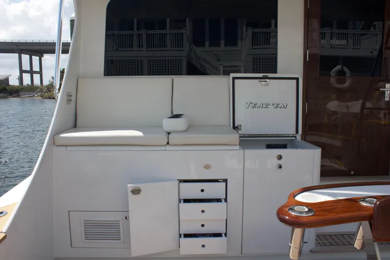 Slide: The Image of Hudson Custom Carolina 2004 yacht interior with seating and storage. - 18