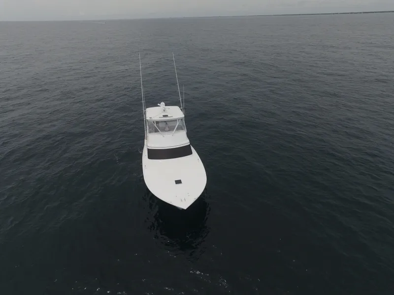 Slide: The Image of 2004 Hudson Custom Carolina boat on open sea. - 2