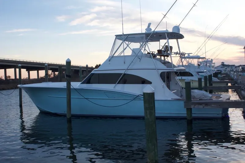 Slide: The Image of 2004 Hudson Custom Carolina yacht docked at sunset. - 4