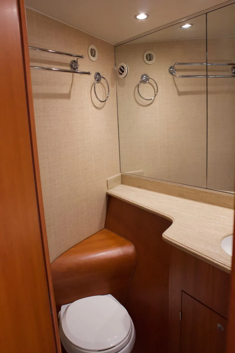 Slide: The Image of Bathroom in 2004 Hudson Custom Carolina boat, featuring mirror and toilet. - 44