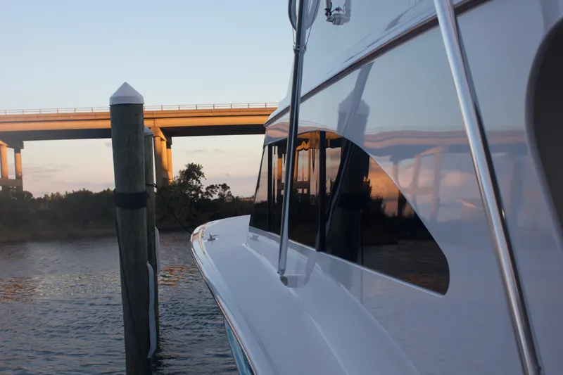 Slide: The Image of Hudson Custom Carolina 2004 boat docked at sunset. - 8