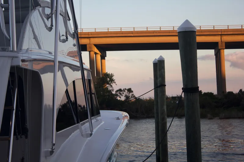 Slide: The Image of Hudson Custom Carolina 2004 boat docked at sunset. - 9