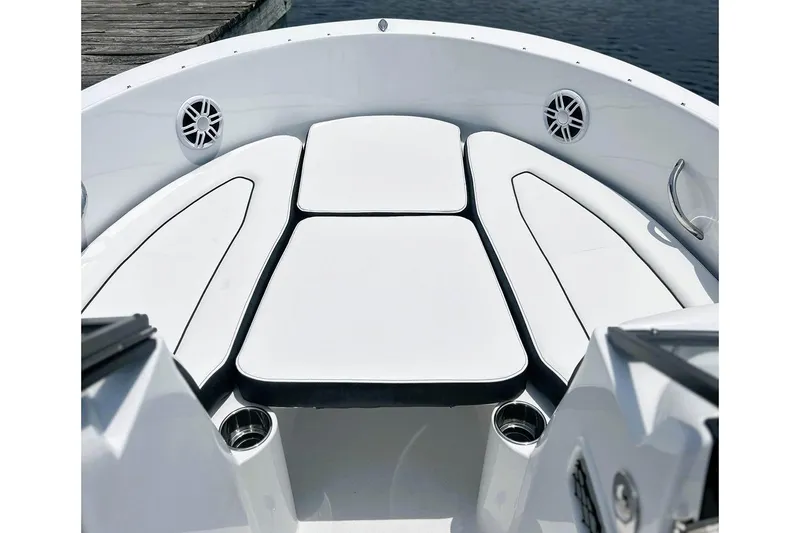 Slide: The Image of Manufacturer Provided Image: 2026 Stingray 172 DC boat interior with white cushioned seating and cup holders. - 10