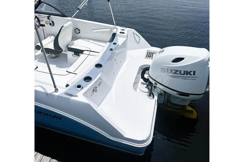 Slide: The Image of Manufacturer Provided Image: 2026 Stingray 172 DC boat with Suzuki outboard motor on calm water. - 14