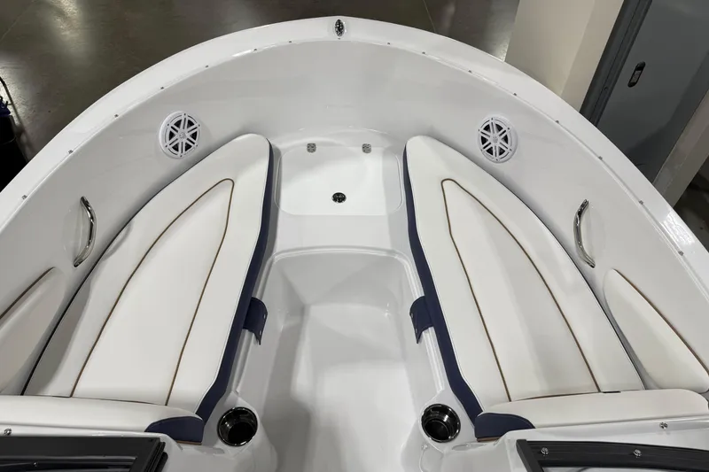 Slide: The Image of 2026 Stingray 172 DC boat interior with white cushioned seating and built-in speakers. - 6