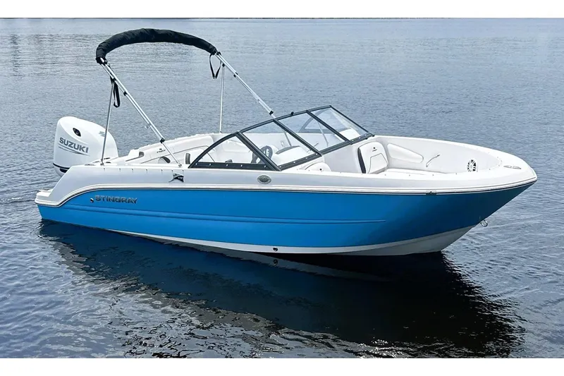 Slide: The Image of Manufacturer Provided Image: 2026 Stingray 172 DC boat with Suzuki engine on calm water. - 8