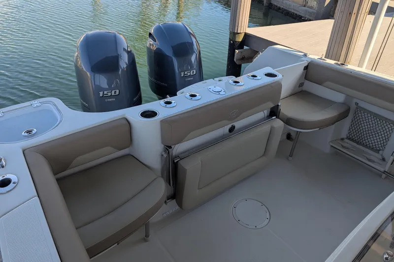 Slide: The Image of 2018 Sailfish 270 CC boat interior with twin Yamaha 150 engines. - 14