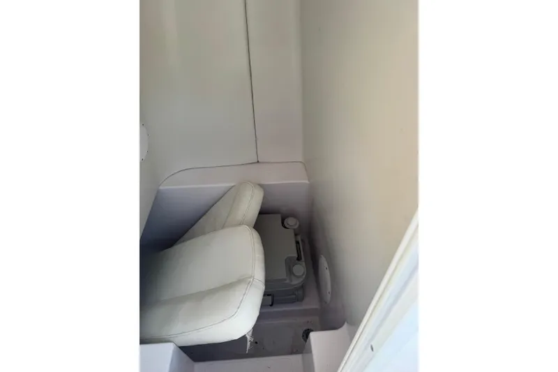 Slide: The Image of 2007 PROLINE 23 Sport boat interior with compact seating and storage area. - 11