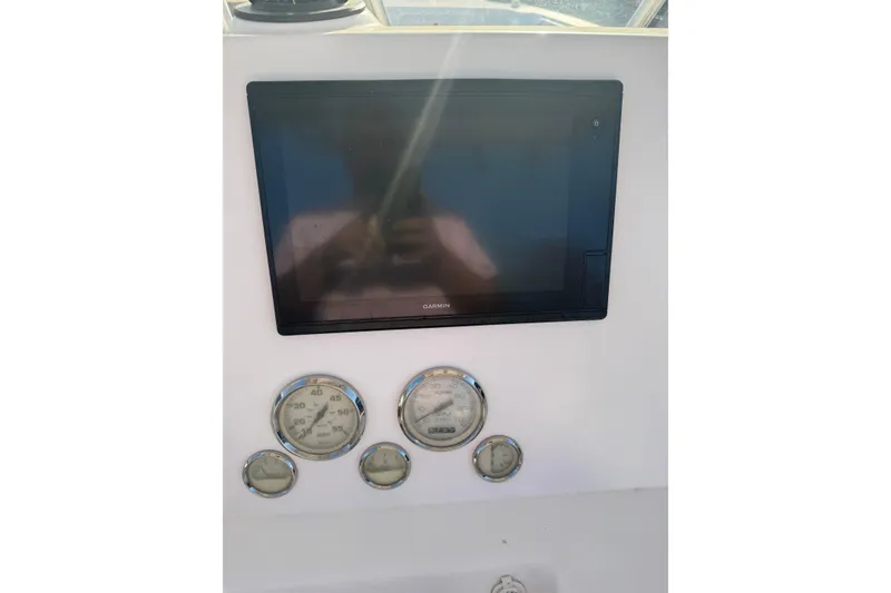 Slide: The Image of Dashboard of 2007 PROLINE 23 Sport boat with Garmin display and gauges. - 12