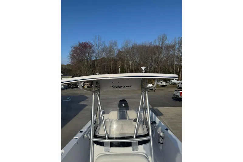 Slide: The Image of 2007 PROLINE 23 Sport boat with T-top, parked outdoors on a sunny day. - 9