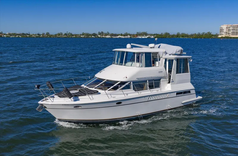 The Image of 1998 Carver 455 Aft Cabin Motor Yacht on open water. - 0
