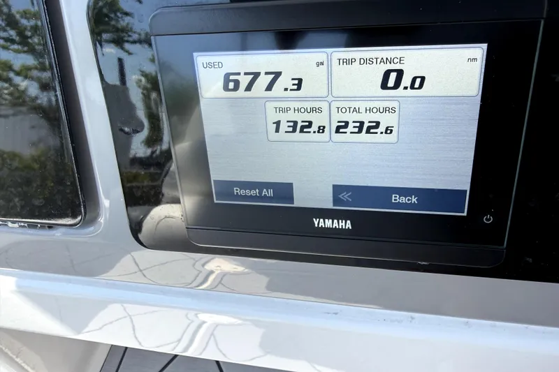 Slide: The Image of Yamaha display on 2022 Robalo 266 Cayman showing fuel usage and trip data. - 11