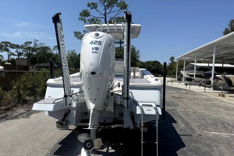 Slide: The Image of 2022 Robalo 266 Cayman boat with Yamaha 425 V8 engine, parked outdoors. - 3