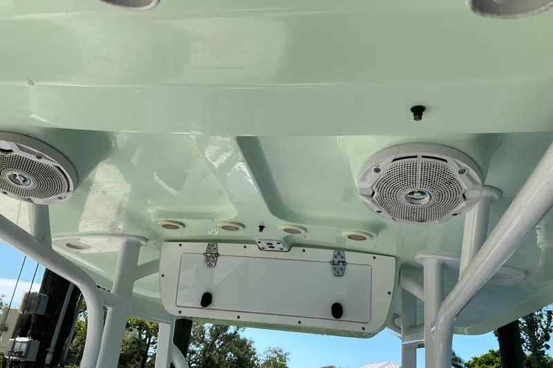 Slide: The Image of 2016 Sea Hunt Ultra 225 boat roof with speakers and storage compartment. - 19