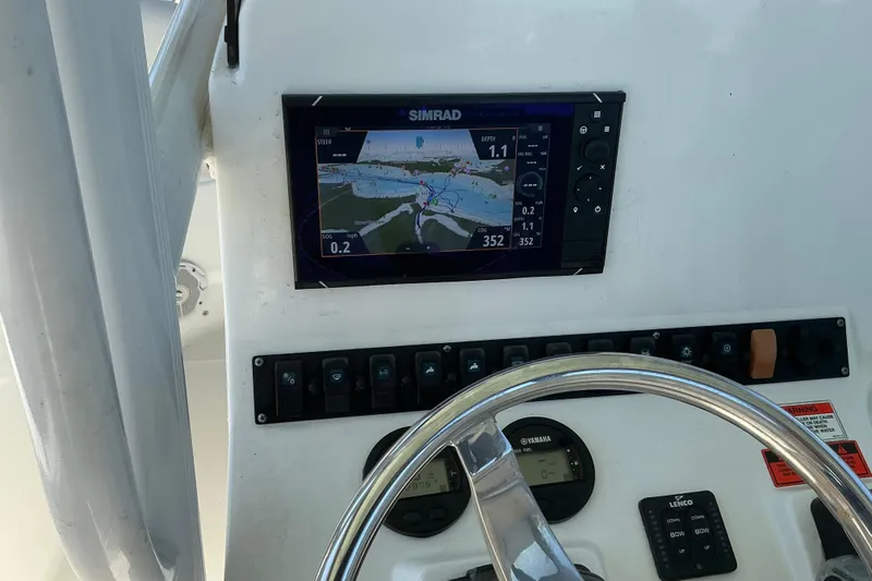 Slide: The Image of Control panel of 2016 Sea Hunt Ultra 225 boat with Simrad navigation display. - 27