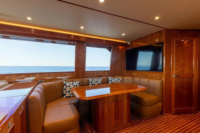 Slide: The Image of Luxurious interior of 2016 Viking 82 Sky Bridge yacht with ocean view and elegant wood finishes. - 16