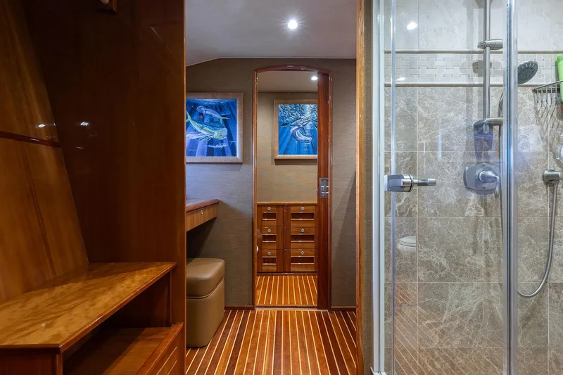 Slide: The Image of Luxurious interior of 2016 Viking 82 Sky Bridge yacht with elegant wood finishes and modern shower. - 20