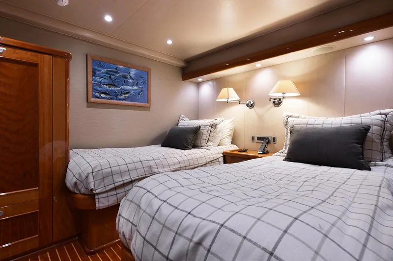 Slide: The Image of Luxurious cabin interior of 2016 Viking 82 Sky Bridge yacht with twin beds and elegant decor. - 25