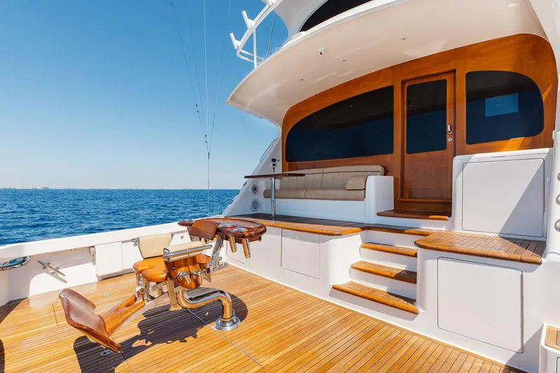 Slide: The Image of Luxurious 2016 Viking 82 Sky Bridge yacht deck with seating and ocean view. - 3