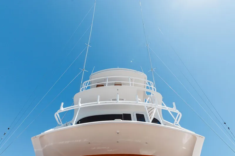 Slide: The Image of 2016 Viking 82 Sky Bridge yacht against clear blue sky. - 7