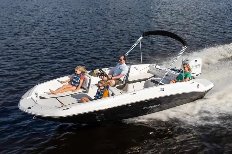 Slide: The Image of Manufacturer Provided Image: 2026 Stingray 182 SC boat cruising on water with passengers enjoying the ride. - 10