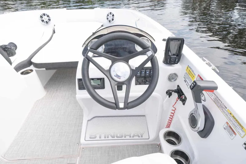 Slide: The Image of Manufacturer Provided Image: 2026 Stingray 182 SC boat cockpit with steering wheel and control panel. - 12