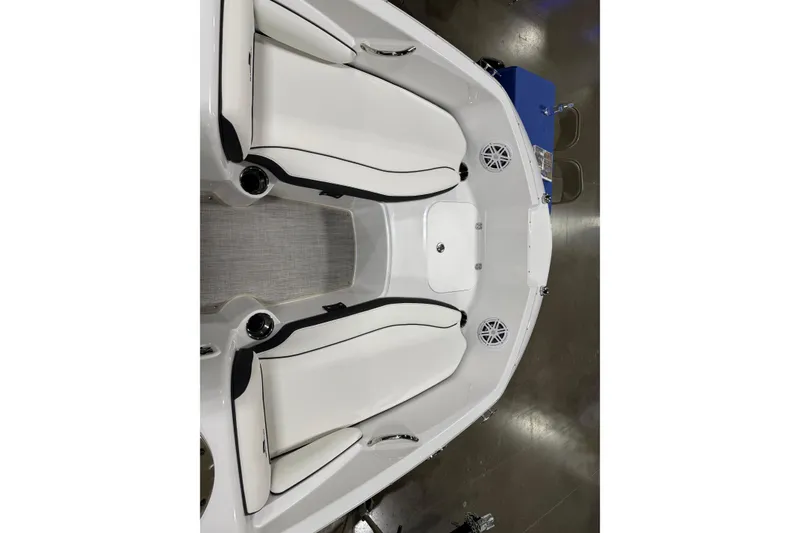 Slide: The Image of 2026 Stingray 182 SC boat interior with white seating and speakers. - 4