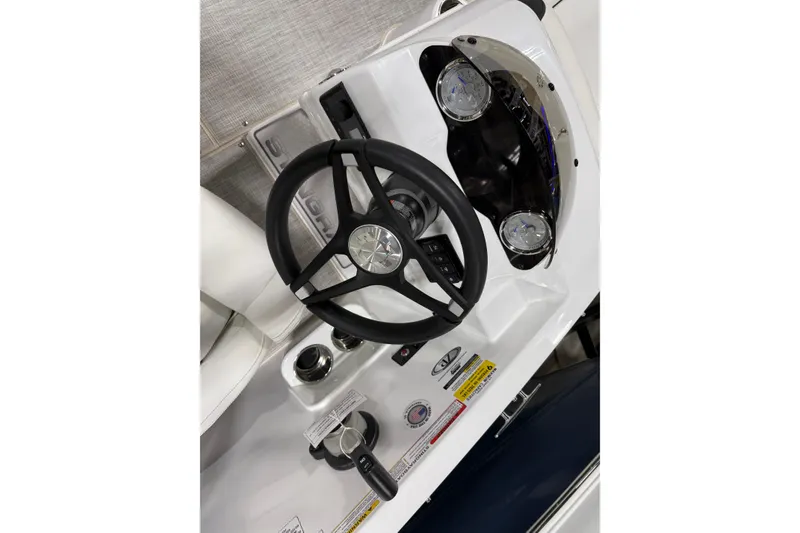 Slide: The Image of Steering console of 2026 Stingray 182 SC boat with gauges and controls. - 8