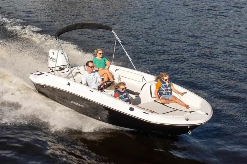 Slide: The Image of Manufacturer Provided Image: 2026 Stingray 182 SC boat cruising with passengers on a sunny day. - 9