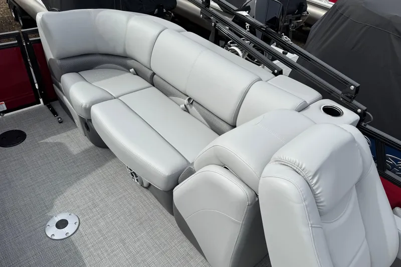 Slide: The Image of Luxurious seating on 2025 Regency 230 DL3 pontoon boat with gray upholstery and cup holder. - 13