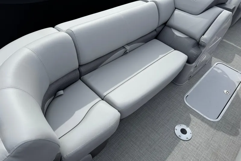 Slide: The Image of Luxurious seating on 2025 Regency 230 DL3 pontoon boat with sleek gray upholstery. - 6