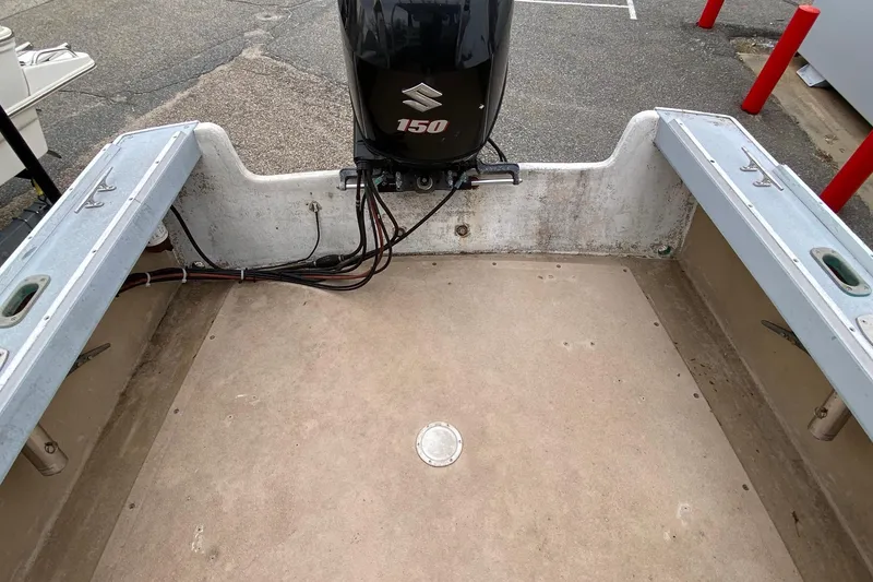 Slide: The Image of 1985 SISU Lobster Boat interior with Suzuki 150 outboard motor, showing spacious deck area. - 16