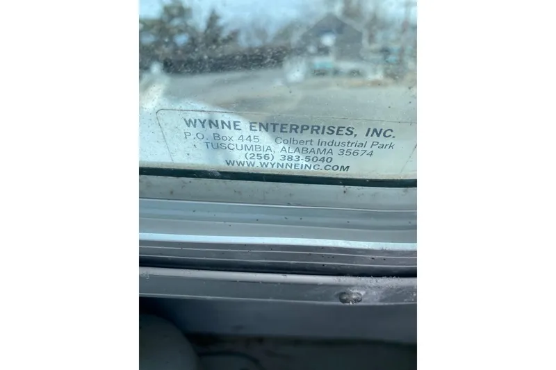 Slide: The Image of 1985 SISU Lobster Boat window with Wynne Enterprises contact label. - 17