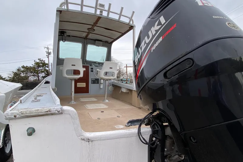 Slide: The Image of 1985 SISU Lobster Boat, 22-foot, with Suzuki outboard motor and dual captain chairs. - 4