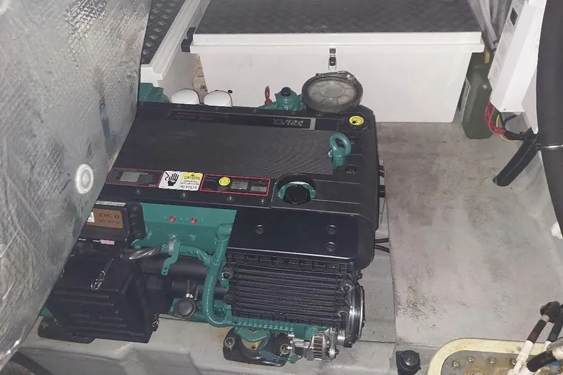 Slide: The Image of Engine compartment of a 2012 Sunseeker Portofino 48 yacht, showcasing mechanical components. - 15