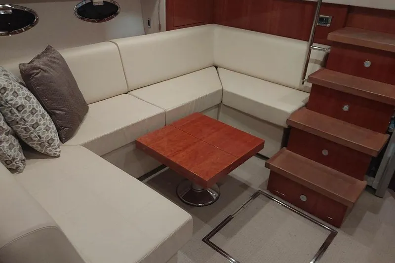 Slide: The Image of Luxurious interior of 2012 Sunseeker Portofino 48 yacht with elegant seating and wooden accents. - 8