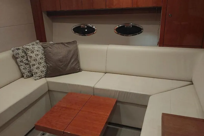 Slide: The Image of Luxurious interior of 2012 Sunseeker Portofino 48 yacht with cream seating and wooden accents. - 9
