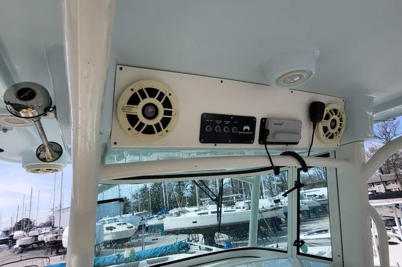 Slide: The Image of 2019 World Cat 320 CC boat interior with speakers and control panel. - 17
