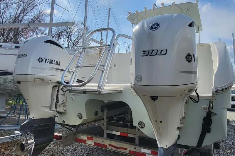 Slide: The Image of 2019 World Cat 320 CC with twin Yamaha 300 engines on a trailer. - 2