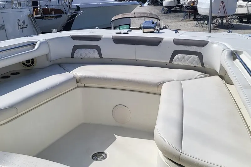 Slide: The Image of 2019 World Cat 320 CC boat interior with cushioned seating and modern design. - 5