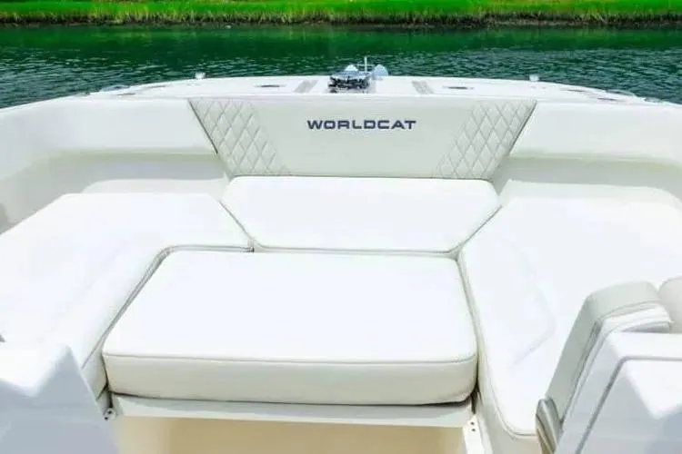 Slide: The Image of 2024 World Cat 260 DC-X boat interior with white cushioned seating. - 4