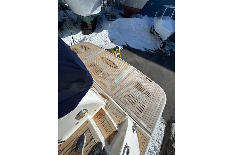 Slide: The Image of 2018 Sea Ray L590 Fly yacht with teak deck in snowy marina. - 12