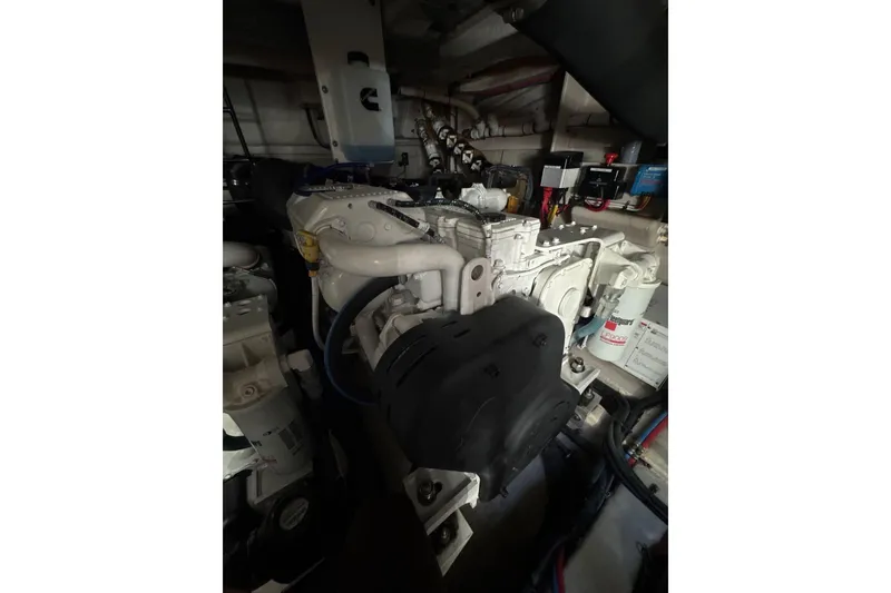 Slide: The Image of Engine room of 2018 Sea Ray L590 Fly yacht, showcasing mechanical components and systems. - 17