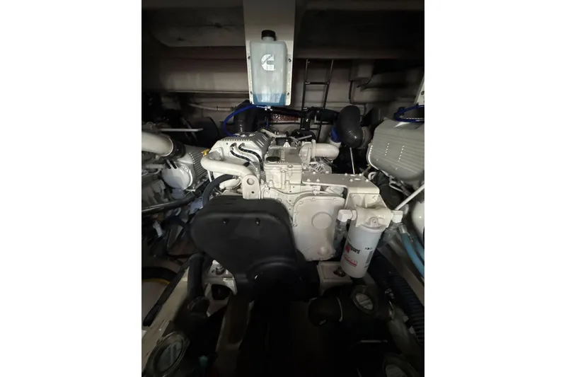 Slide: The Image of Engine room of a 2018 Sea Ray L590 Fly yacht, showcasing mechanical components. - 19
