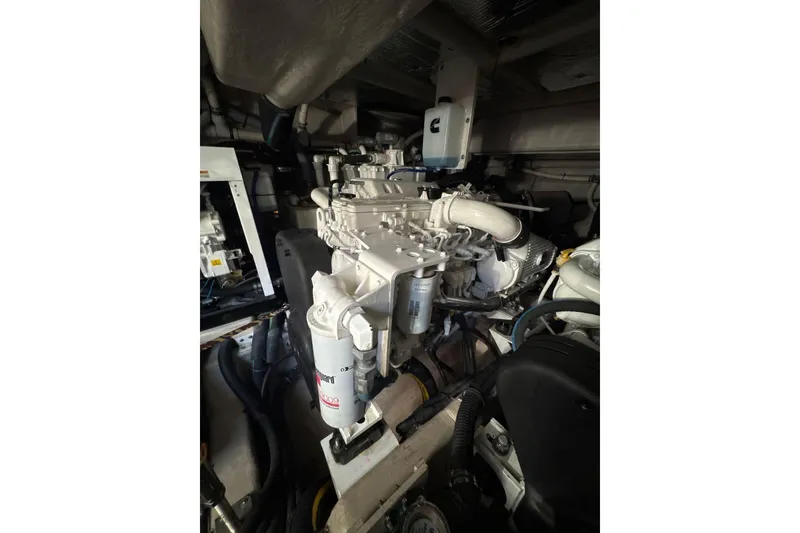 Slide: The Image of Engine room of 2018 Sea Ray L590 Fly yacht, showcasing detailed machinery components. - 20